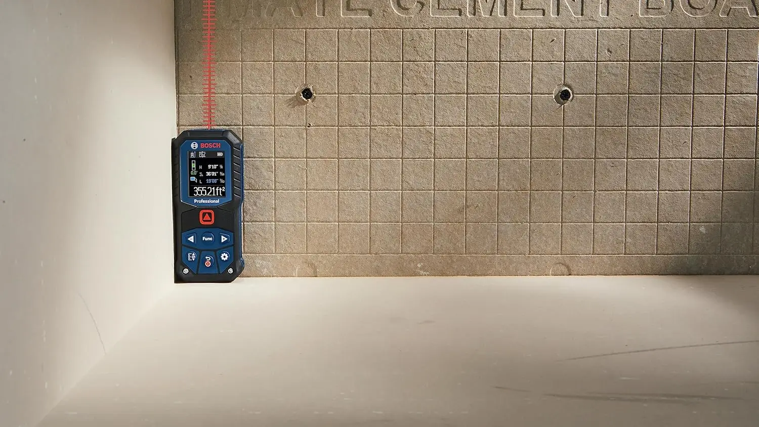 Bosch GLM165-22 Blaze laser distance measure being used by a contractor on a residential construction site